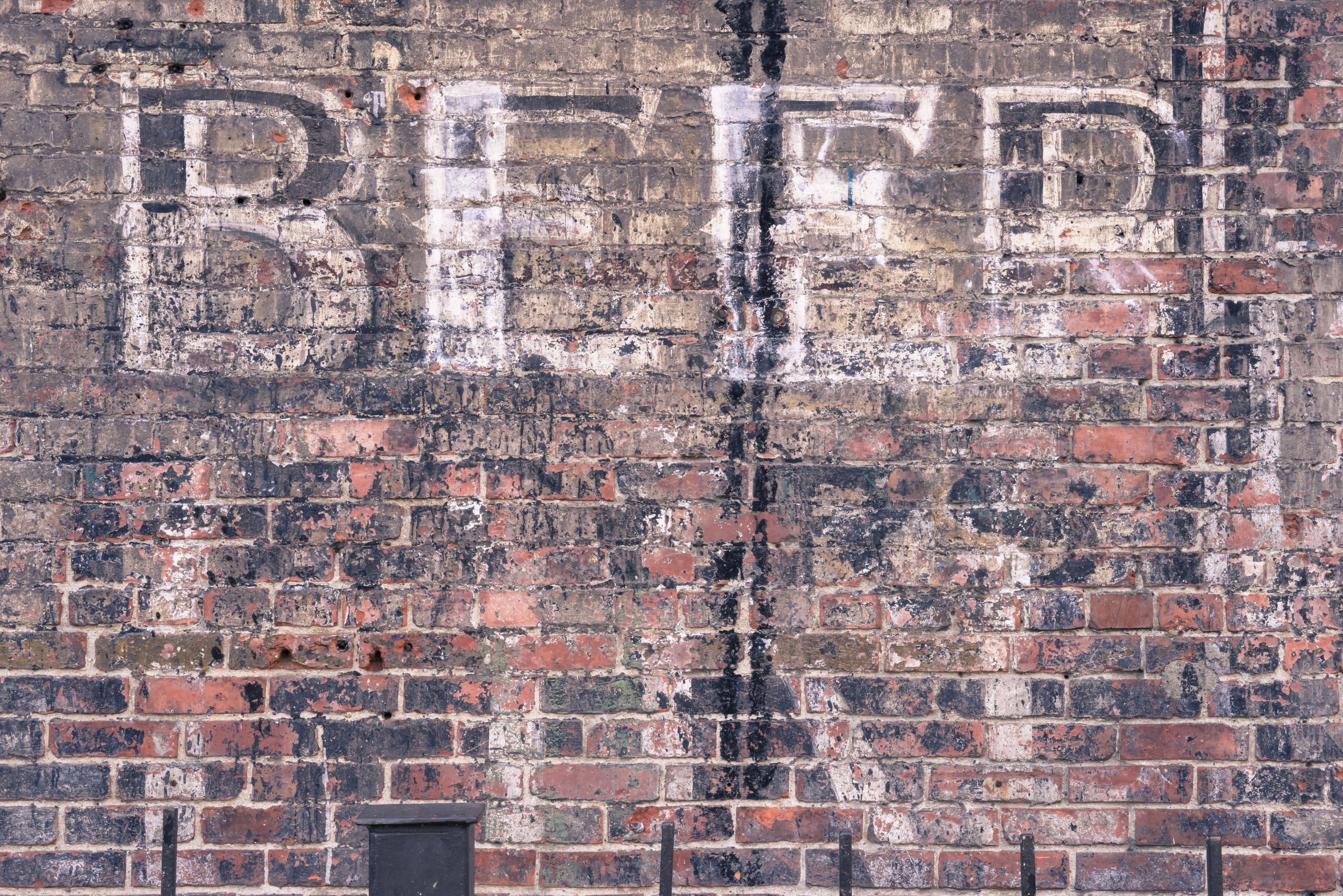 Seattle, USA - January 26, 2014: An old Historic Alki Rainier Beer advertising sign on a brick wall in Occidental park in the historic Pioneer Square neighborhood.