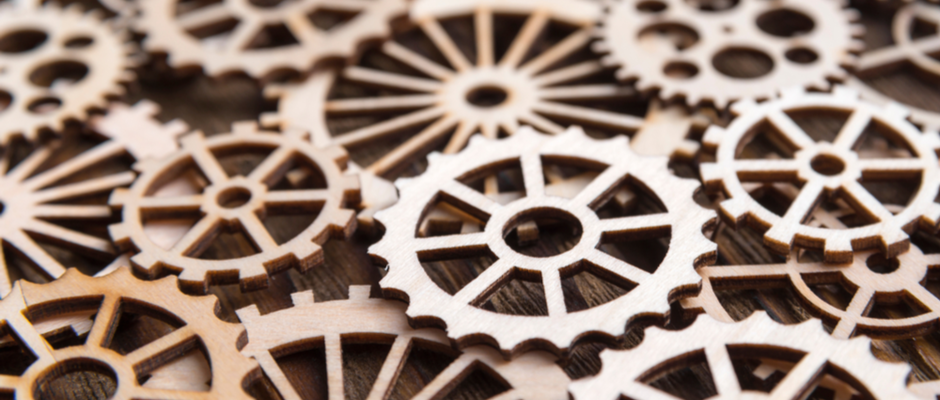 cardboard cogs and wheels in a pile