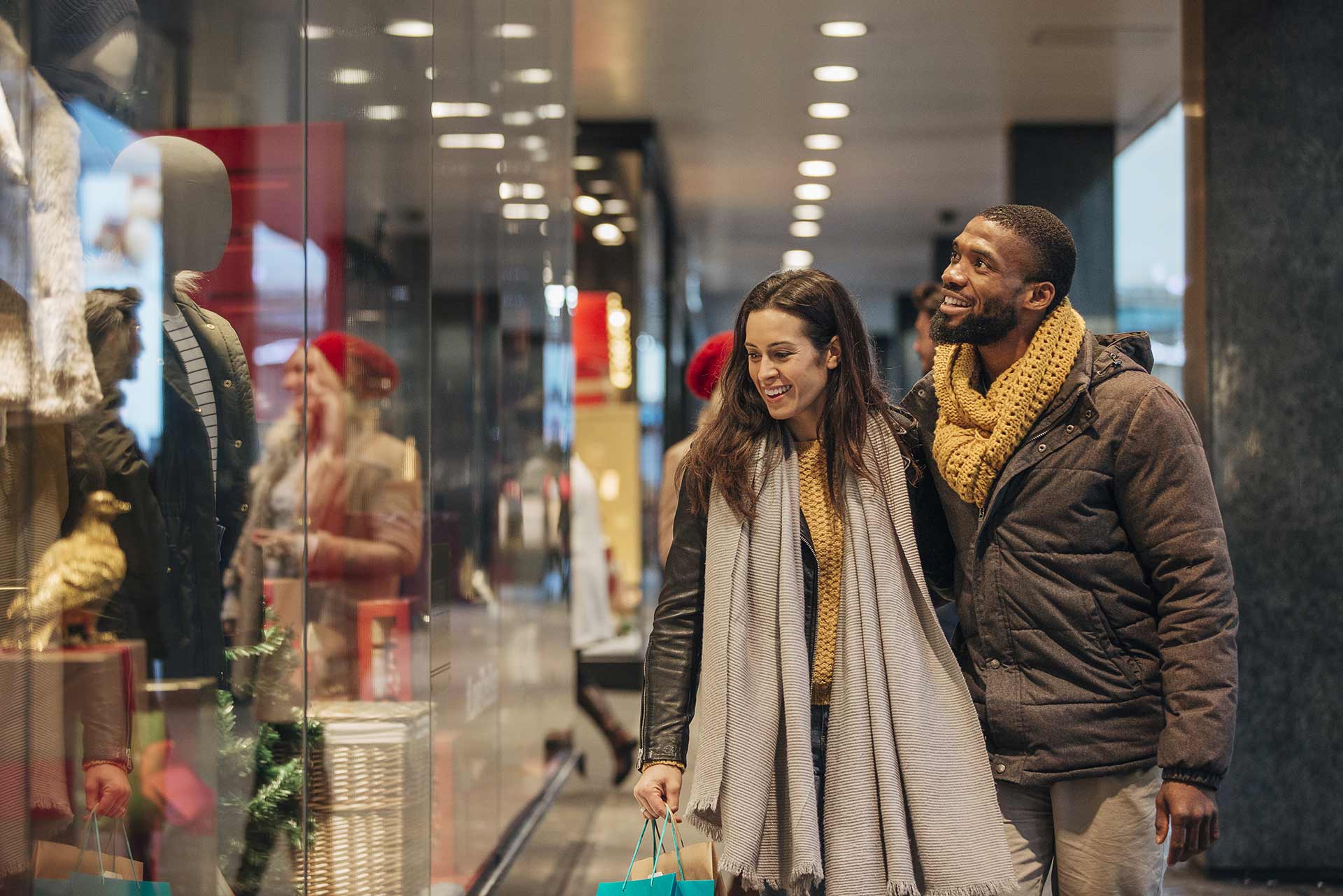 diverse couple buying gifts