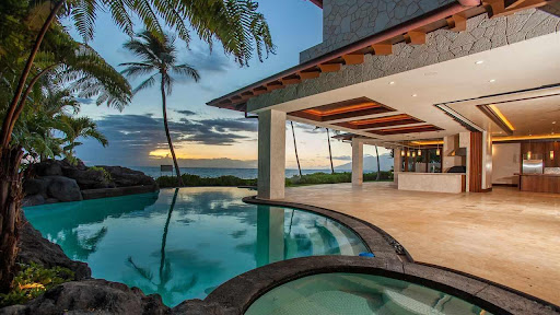 fancy pool and mansion