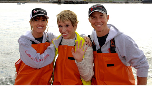 Barbara Corcoran with 2 people in overalls