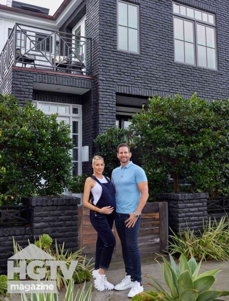 Tarek El Moussa and his wife Heather in front of their Newport Beach home