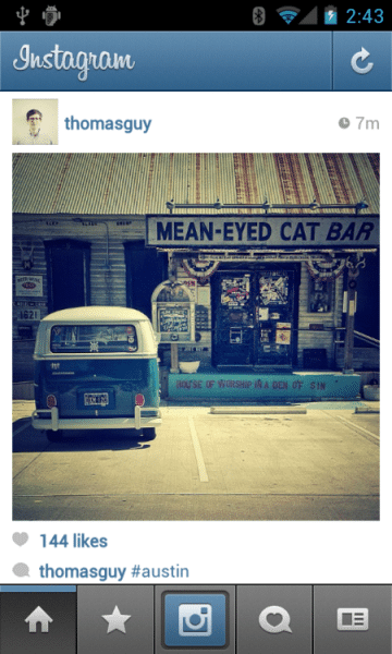 Instagram post of a user called @thomasguy, showing a blue caravan parked in front of a store