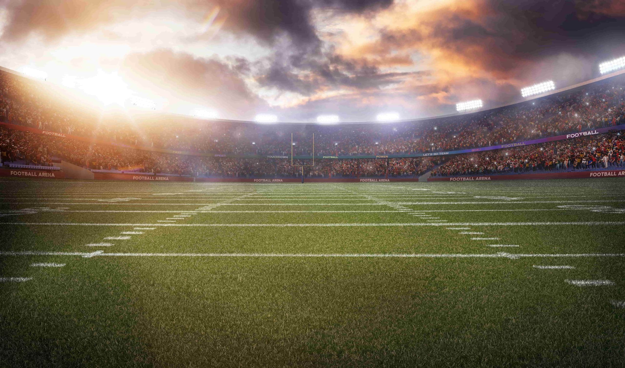 football field with clouds above it