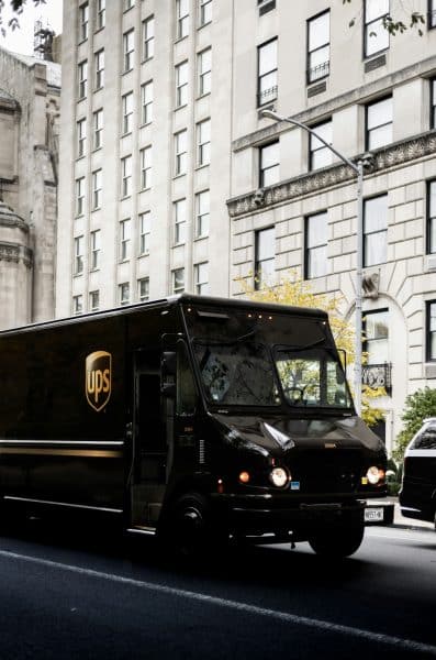 A black UPS truck driving in New York - Unsplash