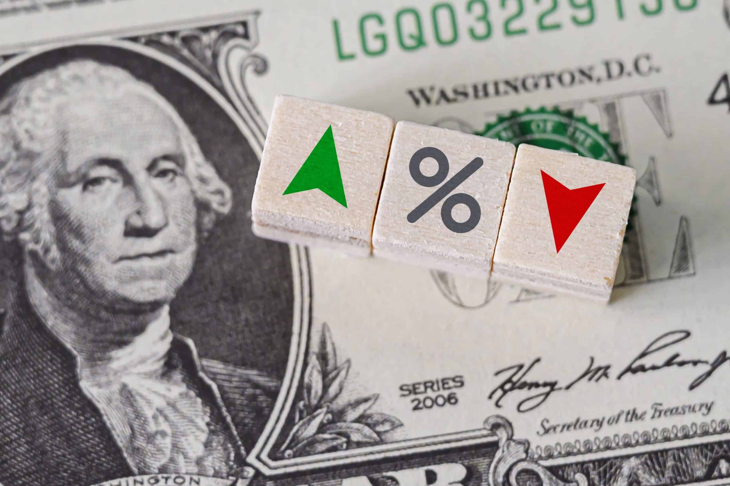 blocks with percentage and arrows on a US dollar