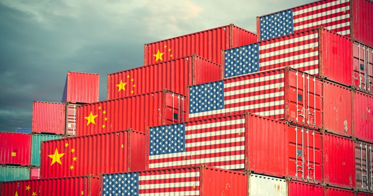 Shipping containers with us and china flags