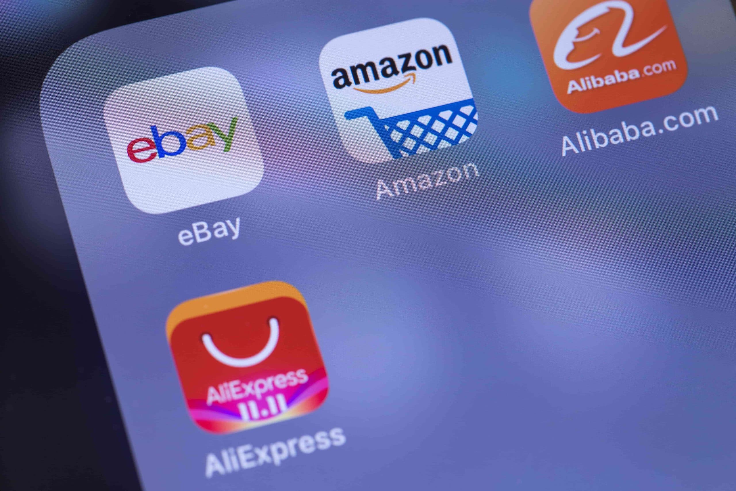 alibaba, aliexpress, amazon, and ebay apps in a folder