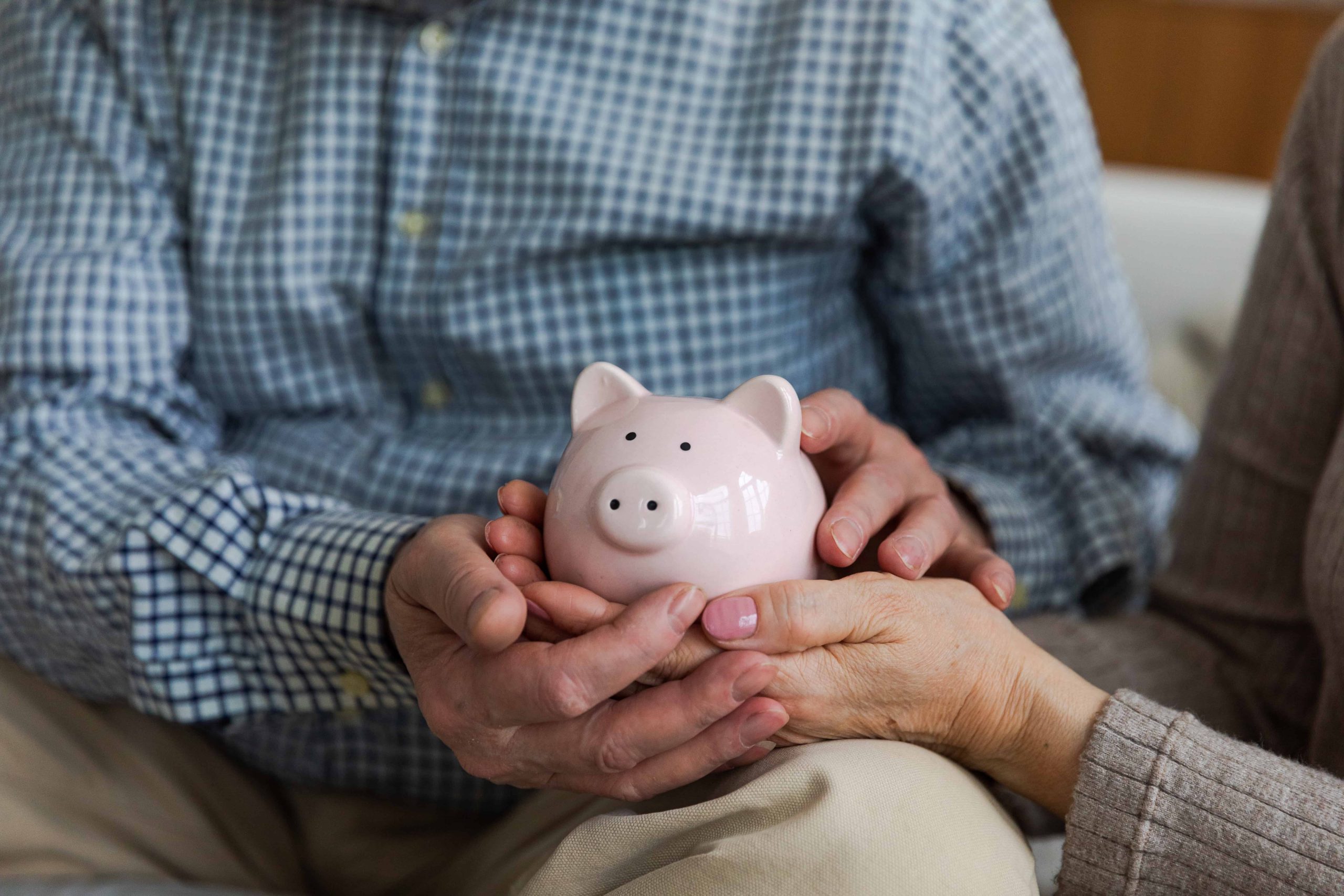 couple holding a piggy bank