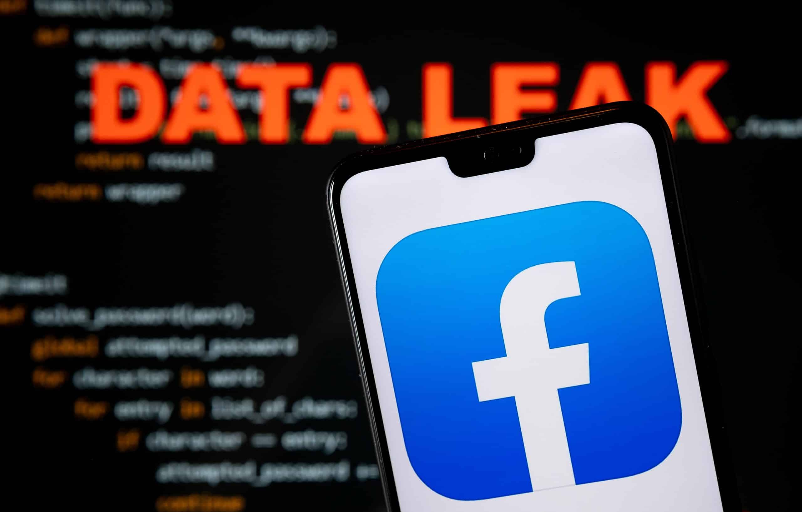 Facebook logo on a phone with Data Breach behind it