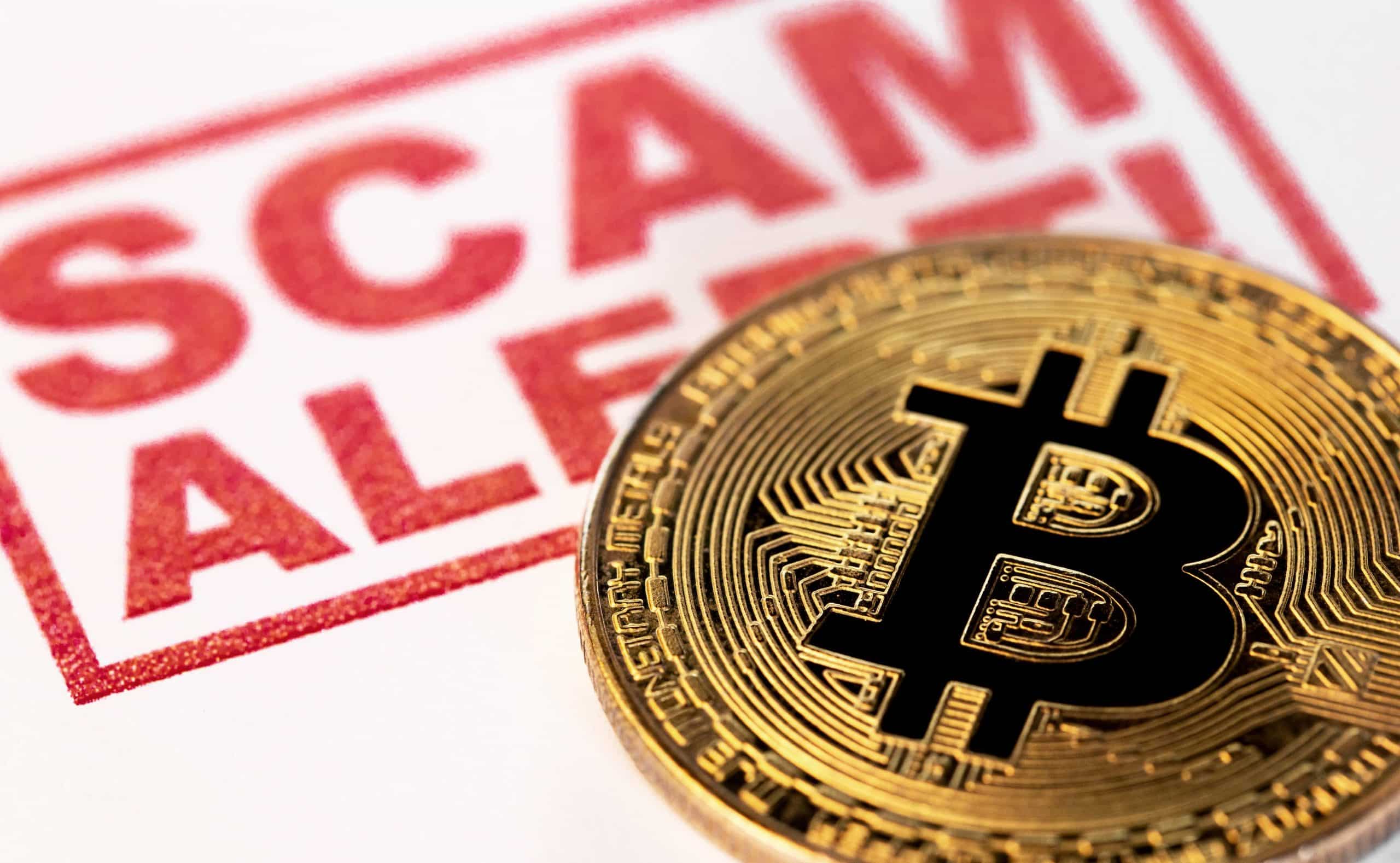 Scam Alert stamp and Bitcoin coin