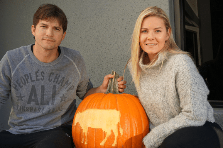 Ashton Kutcher with wife and pumpkin