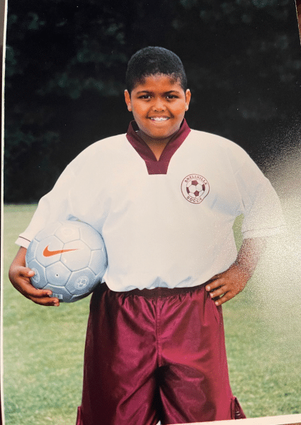 young Druski in a soccer uniform